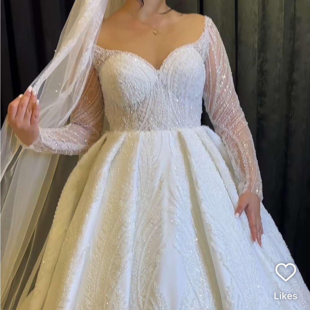 Elegant White Bridal Gown with Beaded Details